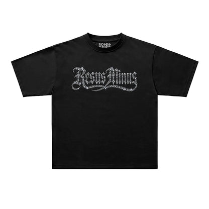 A black short-sleeve t-shirt with a silver gothic-style 'JesusMoms' graphic printed across the chest, displayed flat against a light gray background.