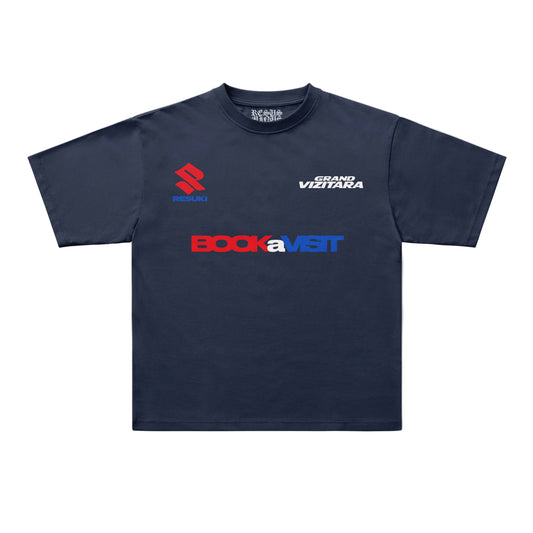 A navy blue short-sleeve t-shirt with multiple sponsor logos printed on the front, including 'BOCKaVISIT' in red and blue, 'GRAND VITITARA' in white, and 'R.S.