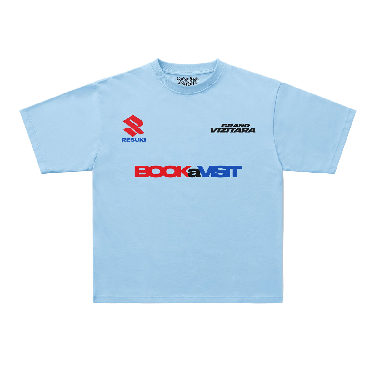 A light blue short-sleeve t-shirt with sponsor logos printed on the chest, including Suzuki, Bock, and Grand Vizita, displayed flat against a light gray background.