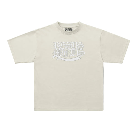 A light beige short-sleeve t-shirt with a stylized white graphic reading 'RESUS MINUS' across the chest, displayed flat against a clean white background.