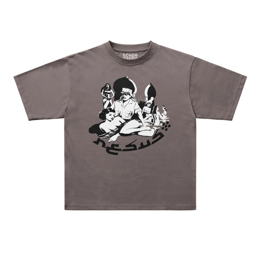 A short-sleeve crewneck t-shirt in a muted taupe-brown color, featuring a black and white graphic print of a seated figure with stylized text on the front, displayed flat against a light gray background.