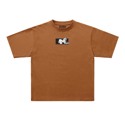A brown short-sleeve crewneck t-shirt with a small black and white graphic print on the left chest, displayed flat against a light gray background.