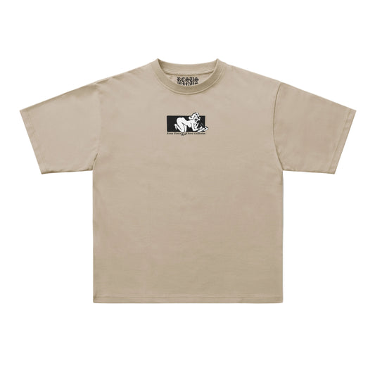 A beige short-sleeve t-shirt with a small black graphic print on the left chest, displayed flat against a light gray background.