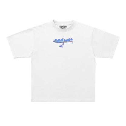 A white short-sleeve crewneck t-shirt featuring a blue graphic of a jet airplane and the word 'desus' printed on the center chest, displayed against a light gray background.