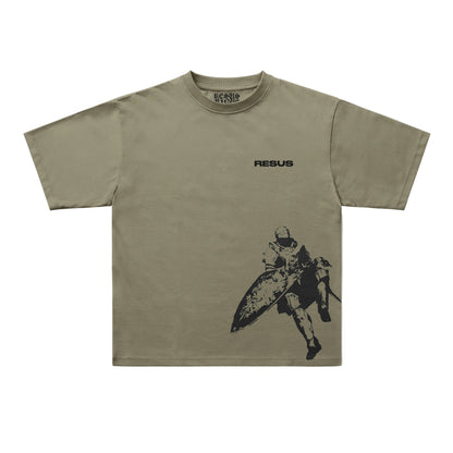 An olive green short-sleeve t-shirt with a black graphic print of a Spartan warrior and the word 'RESUS' on the chest, displayed flat against a light gray background.