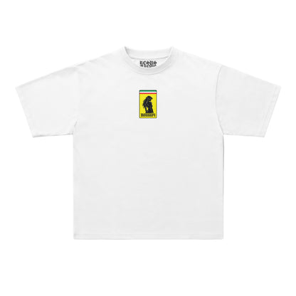 A white short-sleeve crewneck t-shirt with a small graphic on the left chest depicting a black dog silhouette against yellow, green, and red stripes, with 'BEACHWEAR' printed inside the collar.