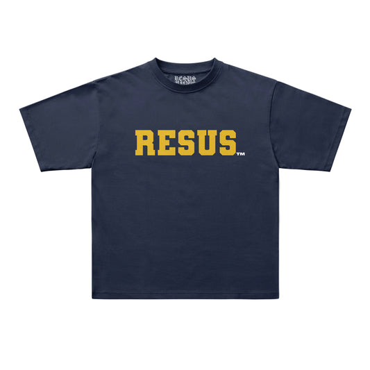 A navy blue short-sleeve t-shirt with the word 'RESUS' printed across the chest in bold yellow varsity-style letters, shown on a light gray background.